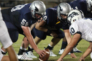 Center Lance Graul stays composed as he prepares to snap the ball to quarterback Chris Johnson.