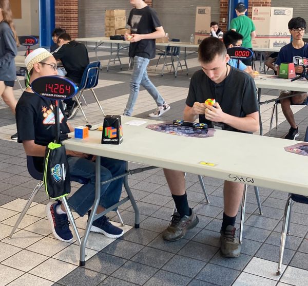 Students from across Texas gather in the Silver cafeteria to compete during the speed cubing event.