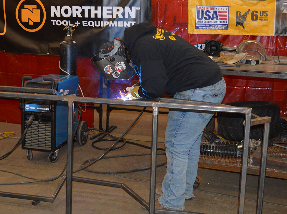 Junior Zaine Nelson welds part of the frame for the monster truck build sponsored by Northern Tool and Monster Jam.